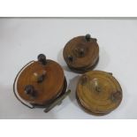 Three walnut and brass fishing reels