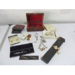 A collection of miscellaneous items including cuff links, costume jewellery, writing/drawing