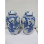 A pair of Chinese blue and white jars and covers, overall height 32 cm