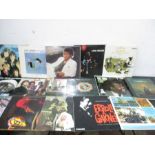 A collection of records including Beatles, Rolling Stones etc.