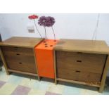 A pair of designer chest of drawers with central orange perspex flower holder - with doors,
