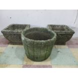 A pair of square concrete garden pots along with one other