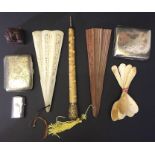 A parasol handle with gold coloured metal top, fans, soapstone seal, EPNS cigarette case etc.