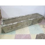 A large concrete trough