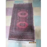 A small pink ground Eastern rug