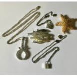 A 925 brooch in the form of a shoal of fish, a 925 silver magnifying glass on chain along with a