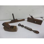 Three wooden tools including planers and a wooden spoon