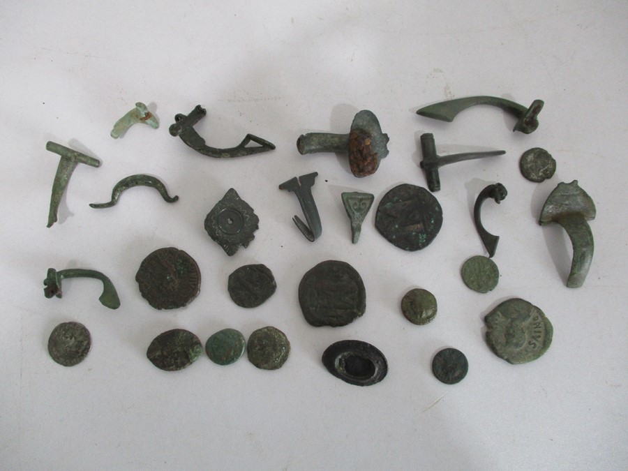 A collection of Roman brooches and coins