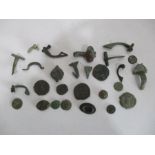A collection of Roman brooches and coins