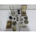 A collection of small interesting items including compasses, vesta case, brass miniature sack