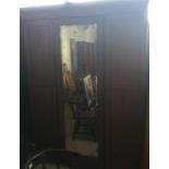 An Edwardian inlaid triple wardrobe