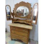 A satinwood dressing chest with three drawers