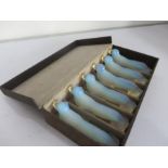 A set of six opalescent knife rests in the form of seals signed Danielo, Paris