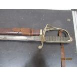 A WWI George V Royal Artillery dress sword in leather scabbard