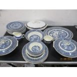 A collection of blue and white dinner ware