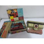 A Vulcan senior child's sewing machine and a tin plate Berwin 'Superior' typewriter