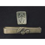 A pewter ring signed Jorgen Jensen and a Sterling silver tie clip by Georg Jensen