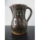 A studio pottery jug by Phil Rogers, impressed monogram to underside, approx 16cm height