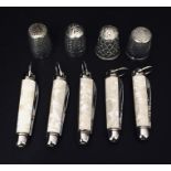 Two hallmarked silver thimbles along with two others and five miniature fruit knives.
