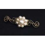 A 9ct brooch set with pearls.