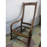 A Victorian rocking chair - in need of upholstering