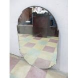 An unframed Art Deco mirror