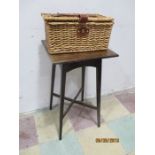 An oak occasional table along with a small wicker picnic basket