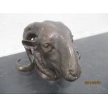 A bronze model of a rams head