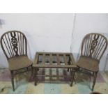 A pair of elm seated wheel back dining chairs along with an oak luggage rack