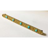 A 12ct gold bar brooch set with turquoise.