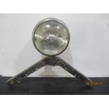 A vintage "King of the road" headlamp on bracket