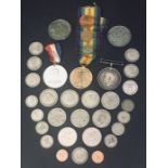 Two WWI medals along with a collection of coins, medallions etc.