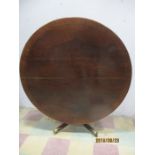 A mahogany Regency tip up breakfast table