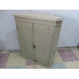 A small painted hanging corner cupboard
