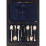 A cased set of 6 hallmarked silver spoons and sugar nips.