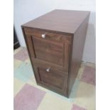 A two drawer wood effect filing cabinet