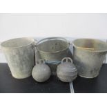 Three galvanised buckets along with two metal fishing buoys