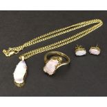 A suite of jewellery consisting of ring, earrings and pendant all set with opals in 18ct gold