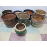 A collection of eight glazed garden pots