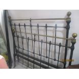 A vintage brass and iron double bed