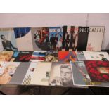 A collection of LP's including Rolling Stones, Beatles and Dire Straits etc.