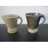 Two Jane Hamelyn mugs both with rope twist handles and impressed marks to underside of handle