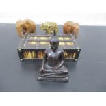A vintage quill box with sliding lid along with three elephant ornaments and an Eastern Deity