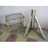 A wrought iron garden table along with a pair of brackets