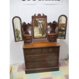 An Edwardian dressing chest with tryptic mirror