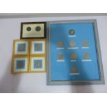 A collection of framed coins including a 1935 Crown and two reproduction Roman coins