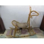 A vintage bamboo rocking horse