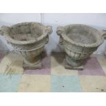 A pair of concrete garden urns A/F