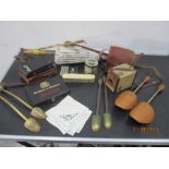 A collection of vintage items including shoe stretchers, tins, cameras etc.