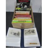 A good collection of vintage boxing postcards along with boxing related books